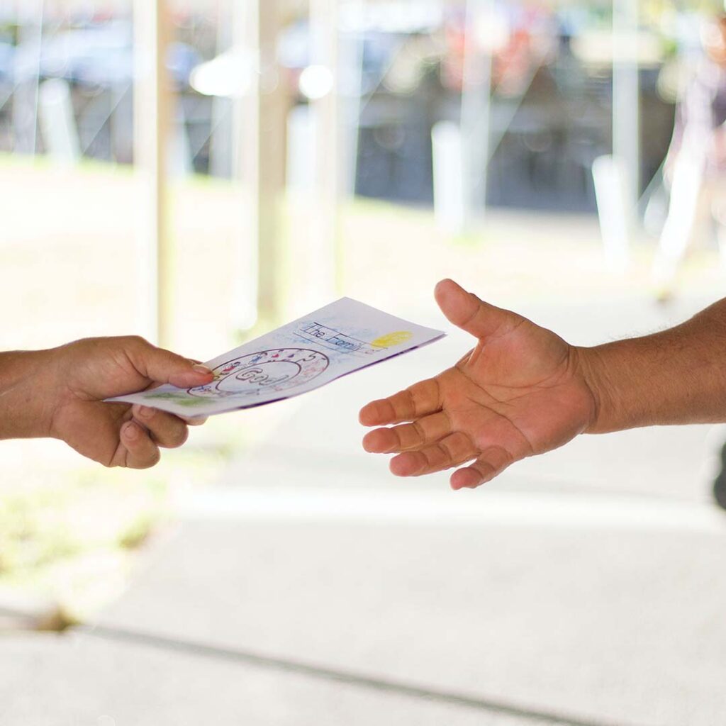 Person handing out an flyer ad