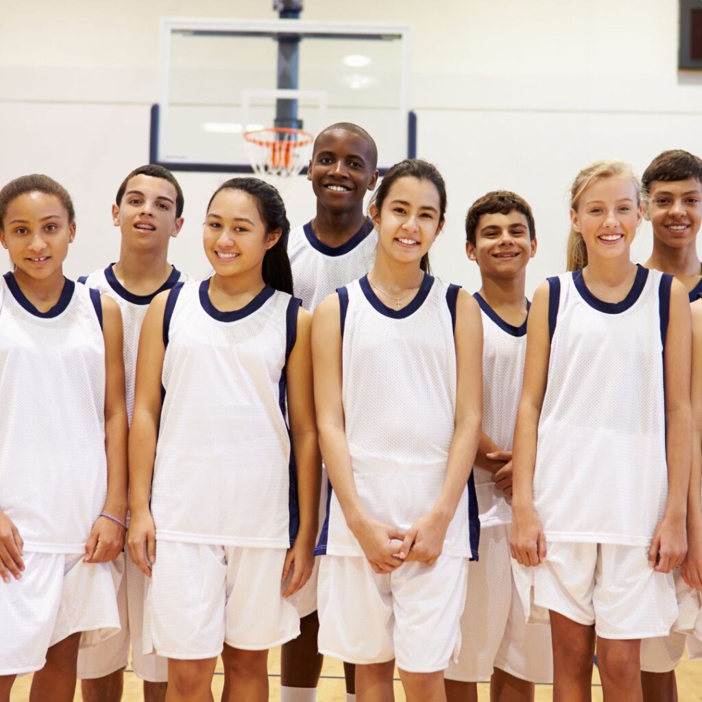 Kids in team photo with white uniforms